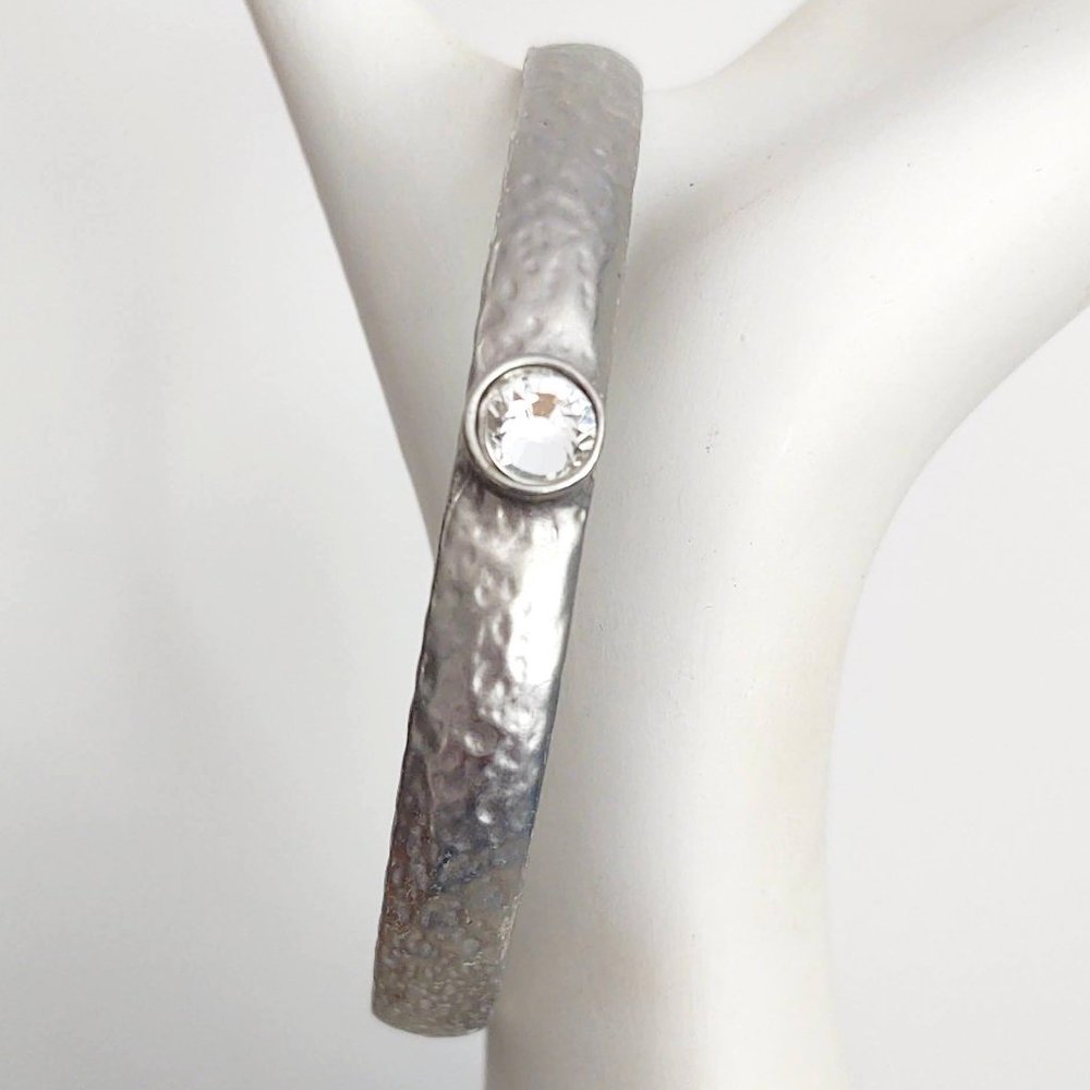 Textured silver bangle with crystal solitaire center